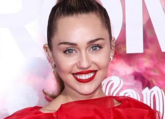 Miley Cyrus wears a red devil suit with sheer tights and patent pumps Miley Cyrus wears a red devil suit with sheer