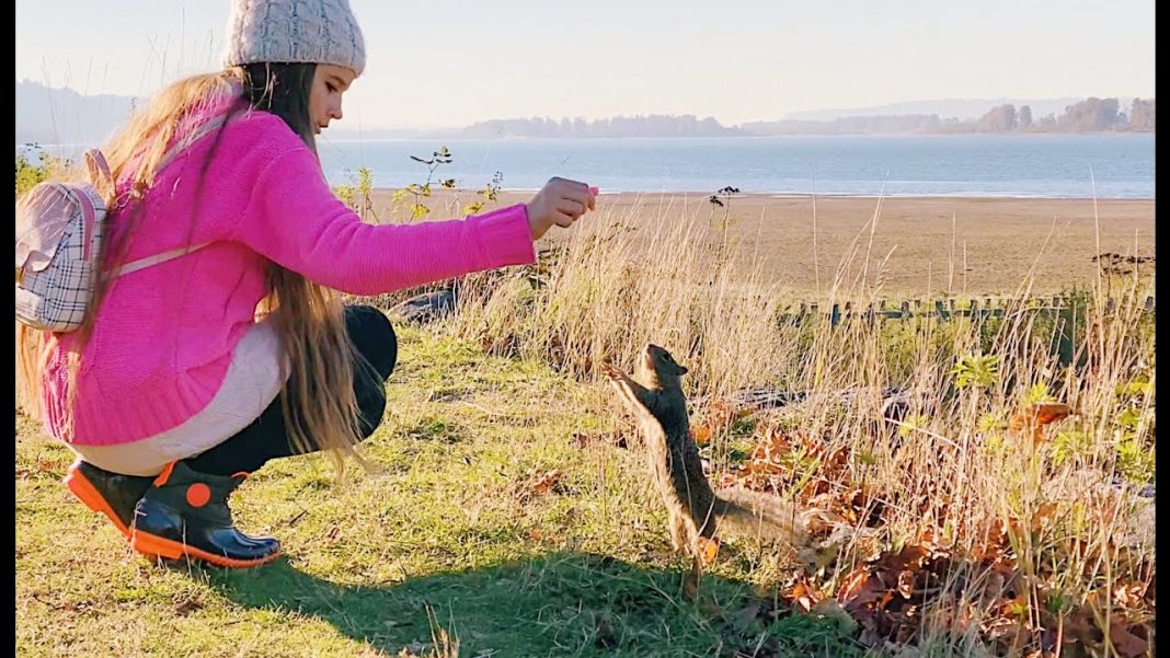 Karolina Protsenko feeds squirrels