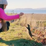 Karolina Protsenko feeds squirrels with her brother Leo Karolina Protsenko feeds squirrels