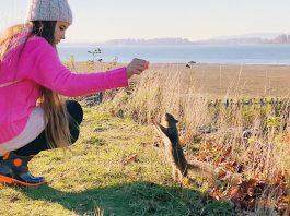 Karolina Protsenko feeds squirrels