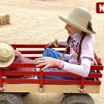 Dad is racing a farm wagon with Karolina Protsenko and Leo Dad is racing a farm wagon with Karolina Protsenko and Leo