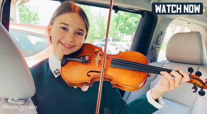 Karolina Playing violin on her knees in the car