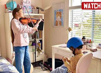 Karolina Protsenko practicing her Violin Karolina Protsenko practicing her Violin