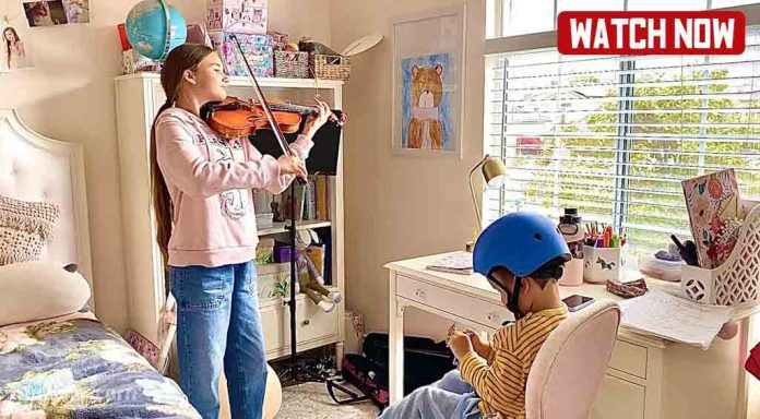 Karolina Protsenko practicing her Violin