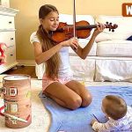 Karolina and Elder Brother Playing Music for her Baby Brother Karolina and Elder Brother Playing Music for her Baby Brother