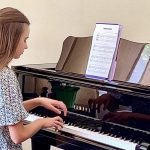 First Piano Lesson – Karolina Protsenko is practicing a new instrument First Piano Lesson - Karolina Protsenko