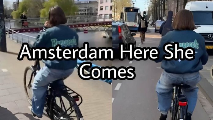 Cycling in Amsterdam - Allie Sherlock on her way to perform